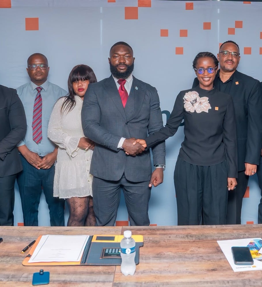 The Orange Botswana and TEMCO teams either side of a handshake at the signing of their memorandum of understanding.
