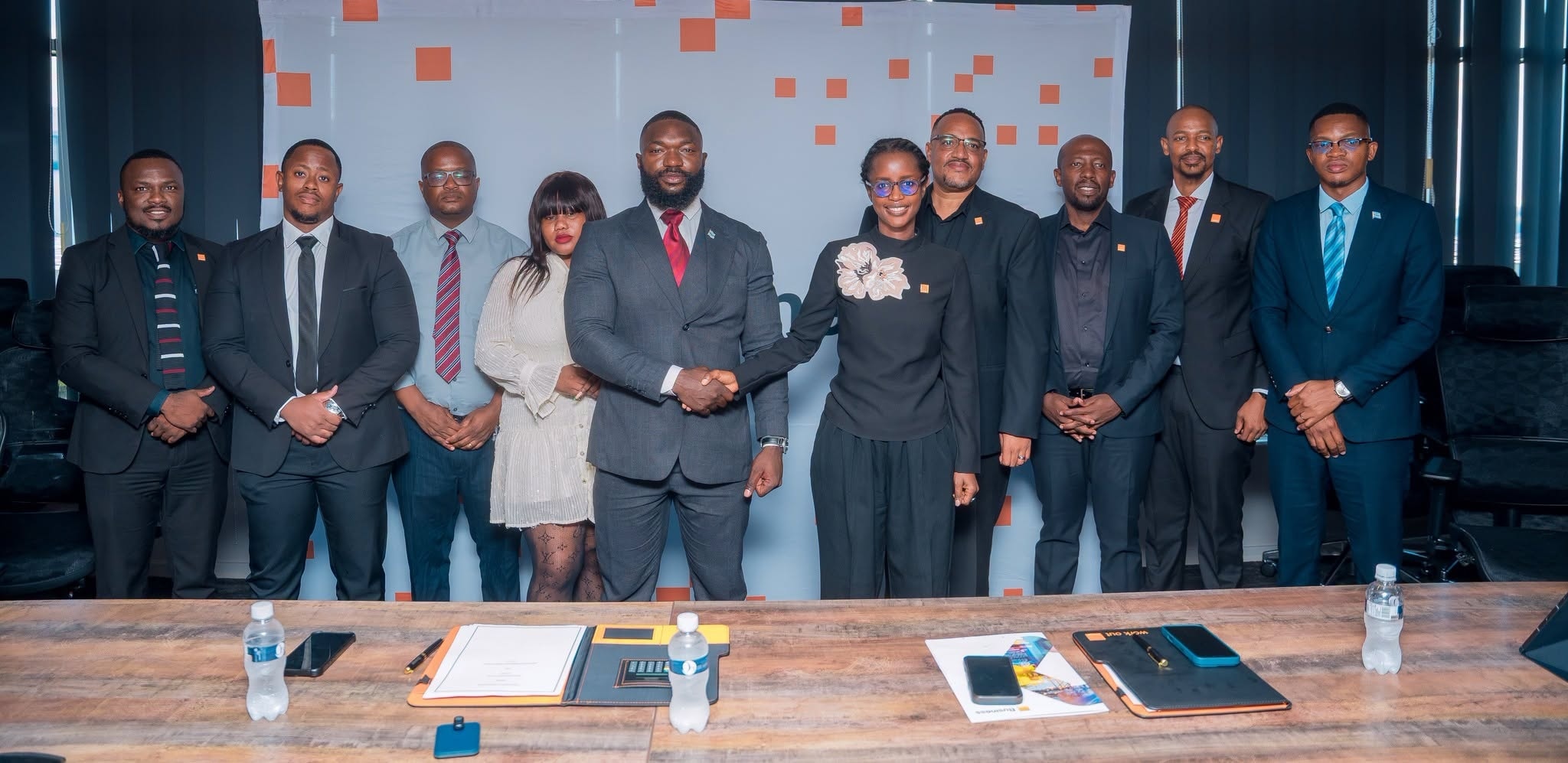 The Orange Botswana and TEMCO teams either side of a handshake at the signing of their memorandum of understanding.